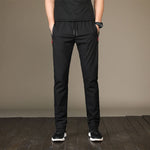 New Men's Casual Pants Autumn Winter Designer Solid Color Plus Size Slim Stretch Pants Men Loose Sweat Pants M~5XL AFK01